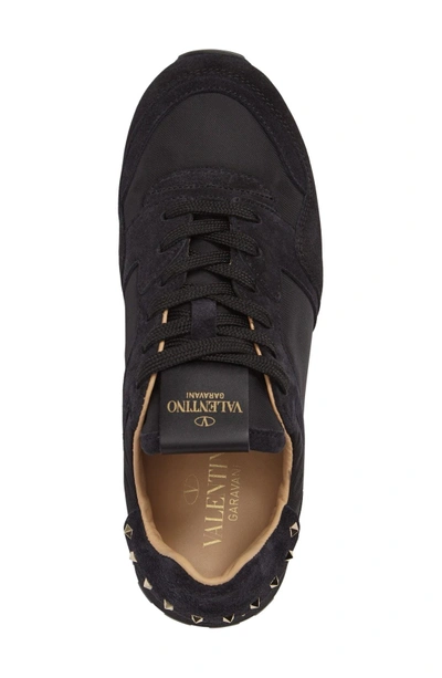 Shop Valentino Rockstud Sneaker In Black