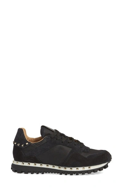 Shop Valentino Rockstud Sneaker In Black