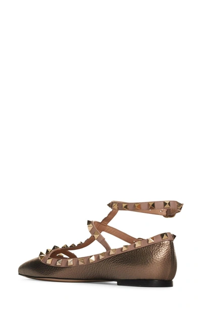Shop Valentino 'rockstud' T-strap Flat In Metallic Rust