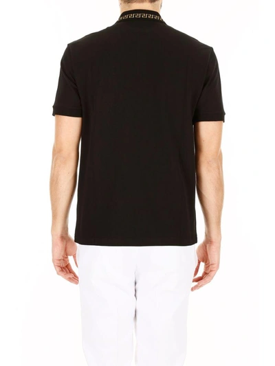 Shop Versace Embroidered Polo Shirt In Nero-oronero