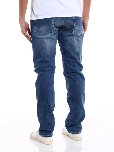 Shop Alexander Mcqueen Straight-leg Distressed Jeans In Blue Washed
