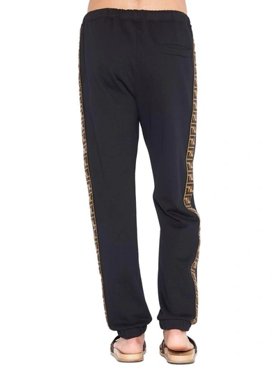 Shop Fendi Trousers In Black