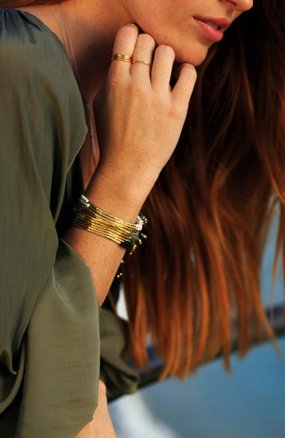 Shop Gorjana Power Gemstone Beaded Bracelet In Crystal Quartz/ Gold