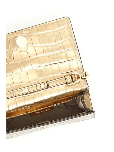 Shop Michael Michael Kors Ruby Clutch In Gold|metallico