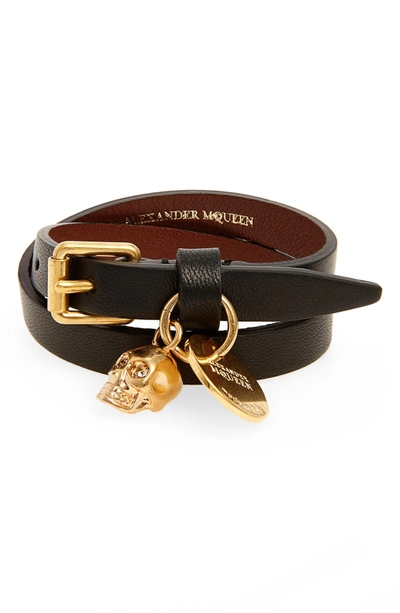 Shop Alexander Mcqueen Skull Charm Leather Wrap Bracelet In Black/ Gold