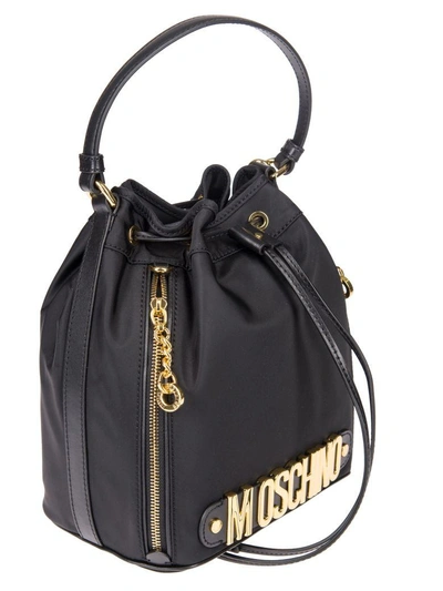 Shop Moschino Logo Plaque Bucket Bag In Black