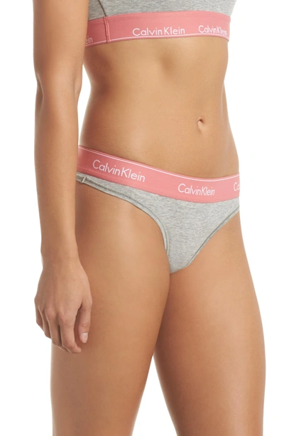 Shop Calvin Klein Logo Thong In Grey Heather Sensation