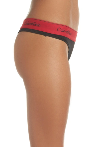 Shop Calvin Klein Logo Thong In Black Empower