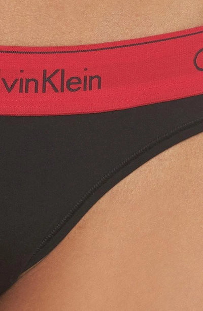 Shop Calvin Klein Logo Thong In Black Empower