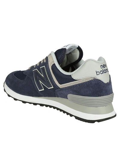 Shop New Balance Ml574 Sneakers