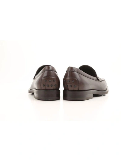 Shop Tod's Penny Bar Detailed Leather Loafers In Brown