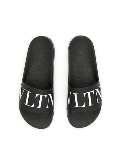 Shop Valentino Pvc Logo Slides In Nero Biancobianco