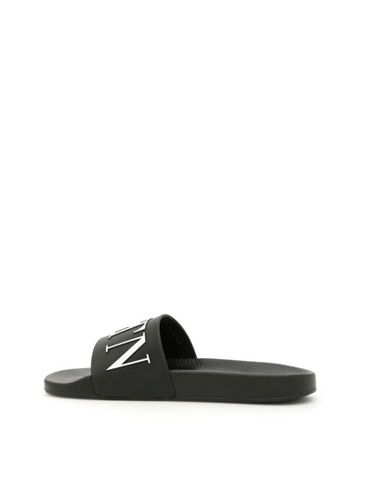 Shop Valentino Pvc Logo Slides In Nero Biancobianco