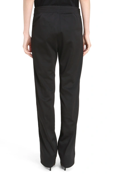 Shop Givenchy Tonal Logo Track Pants In Black