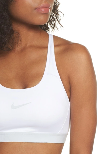 Shop Nike Classic Strappy Sports Bra In White/ Pure Platinum