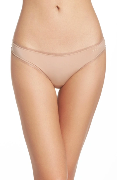 Shop Dkny Low Rise Thong In Glow