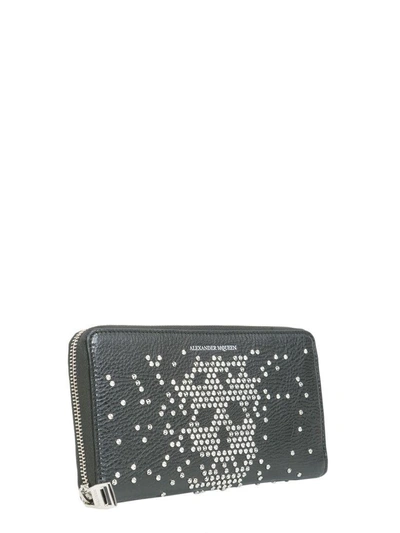 Shop Alexander Mcqueen Studded Skull Zip Around Wallet In Nero