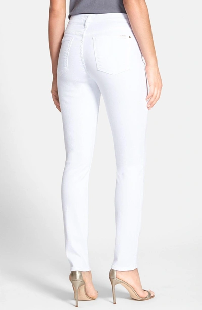 Shop Jen7 Stretch Skinny Jeans In White Denim