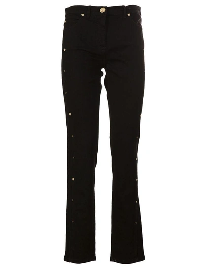Shop Versace Medusa Stud Cropped Jeans In Nero