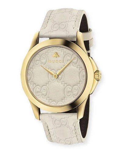 Shop Gucci 38mm G-timeless Watch With Debossed Leather Strap In White/gold