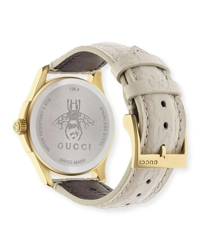 Shop Gucci 38mm G-timeless Watch With Debossed Leather Strap In White/gold
