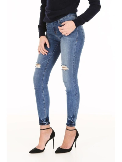 Shop Frame Le Skinny De Jeanne Jeans In Romanblu