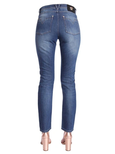 Shop Versace Low Waist Skinny Fit Jeans In Blu