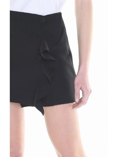 Shop Msgm Ruffle-trimmed Crepe Wrap Mini Skirt In Nero