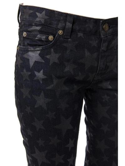 Shop Saint Laurent Stars Print Cotton Denim Jeans In Black