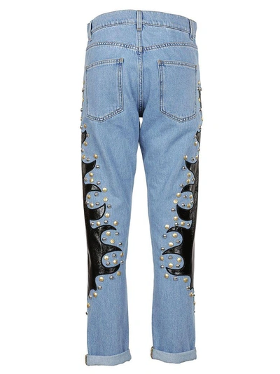Shop Moschino Studded Patch Jeans