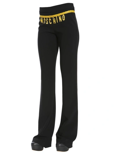 Shop Moschino Chain Belt Printed Trousers In Nero