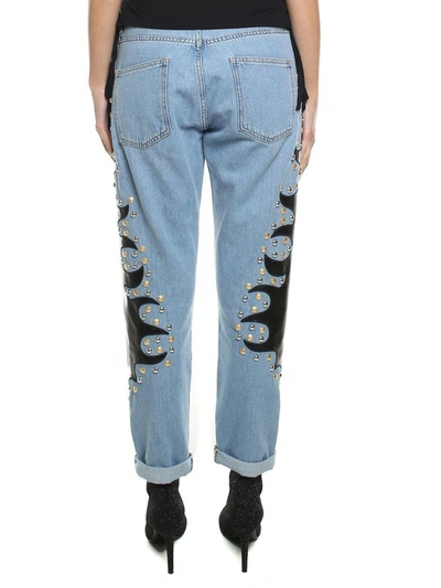 Shop Moschino Studded Embroidered Cotton-denim Jeans In Blu