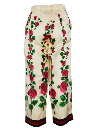 Shop Gucci Floral Print Trousers In Cream