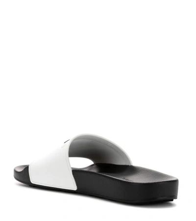 Shop Prada Logo-embossed Slides In White