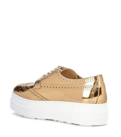 Shop Prada Metallic Leather Platform Sneakers In Gold