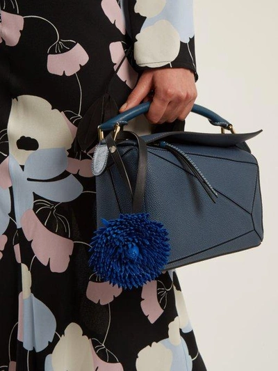 Click here to buy Loewe X William Morris Calendula flower bag charm at  MATCHESFASHION.COM