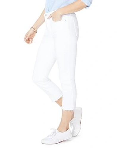 Shop Nydj Released Hem Skinny Capri Jeans In Optic White