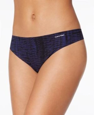 Shop Calvin Klein Invisibles Thong D3428 In Mysterious Skin