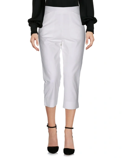Shop Moschino Cropped Pants & Culottes In White