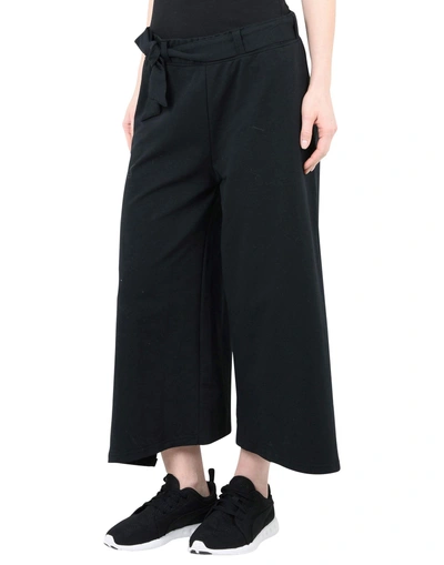 Shop Puma Cropped Pants & Culottes In Black