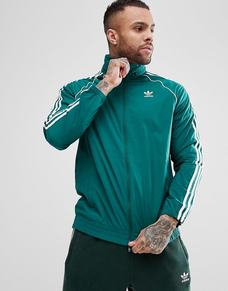 adidas originals adicolor three stripe track jacket in green