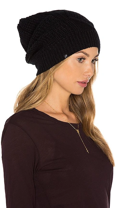 Shop Plush Diamond Cable Knit Beanie In Black