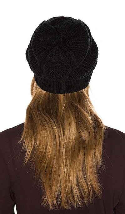 Shop Plush Diamond Cable Knit Beanie In Black