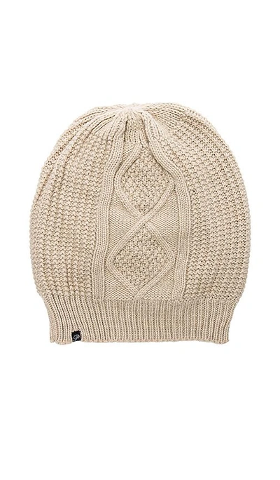 Shop Plush Fleece Lined Cable Knit Beanie In Beige