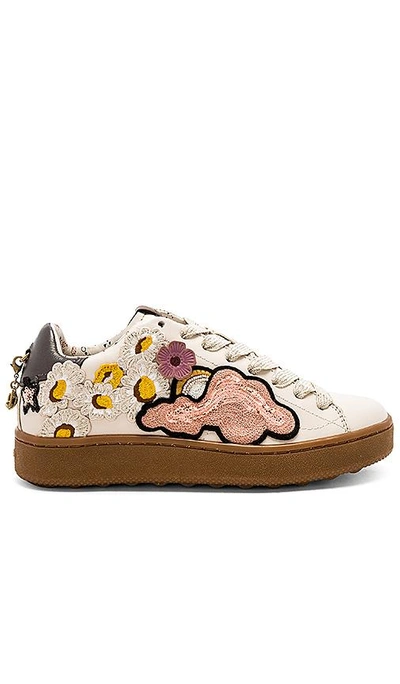 Shop Coach Cloud Patches Sneaker In Ivory