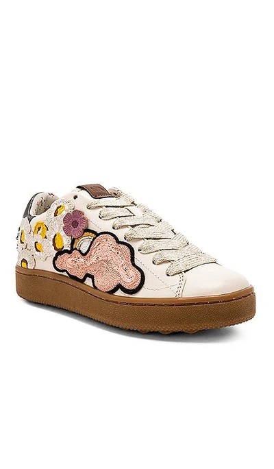 Shop Coach Cloud Patches Sneaker In Ivory