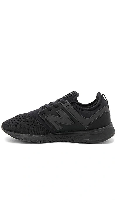 Shop New Balance 247 Sneaker In Black