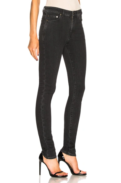 Shop Saint Laurent Medium Rise Skinny Jeans In Black