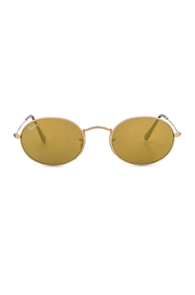 Shop Ray Ban Oval Flat Sunglasses In Gold Flash