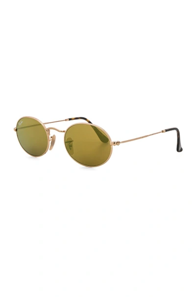 Shop Ray Ban Oval Flat Sunglasses In Gold Flash